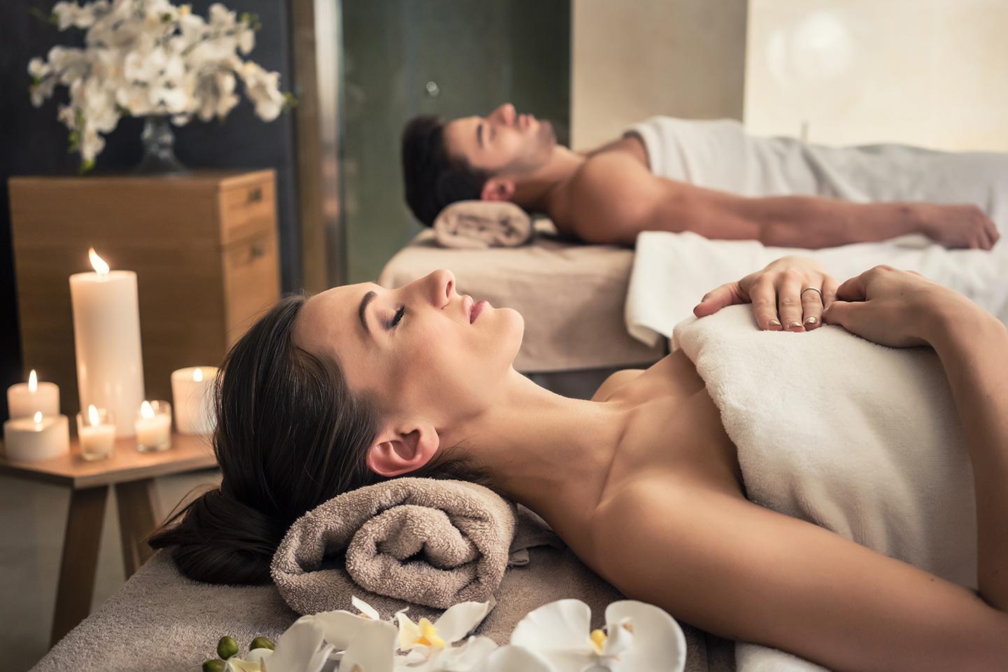 A couple relaxes during a spa massage