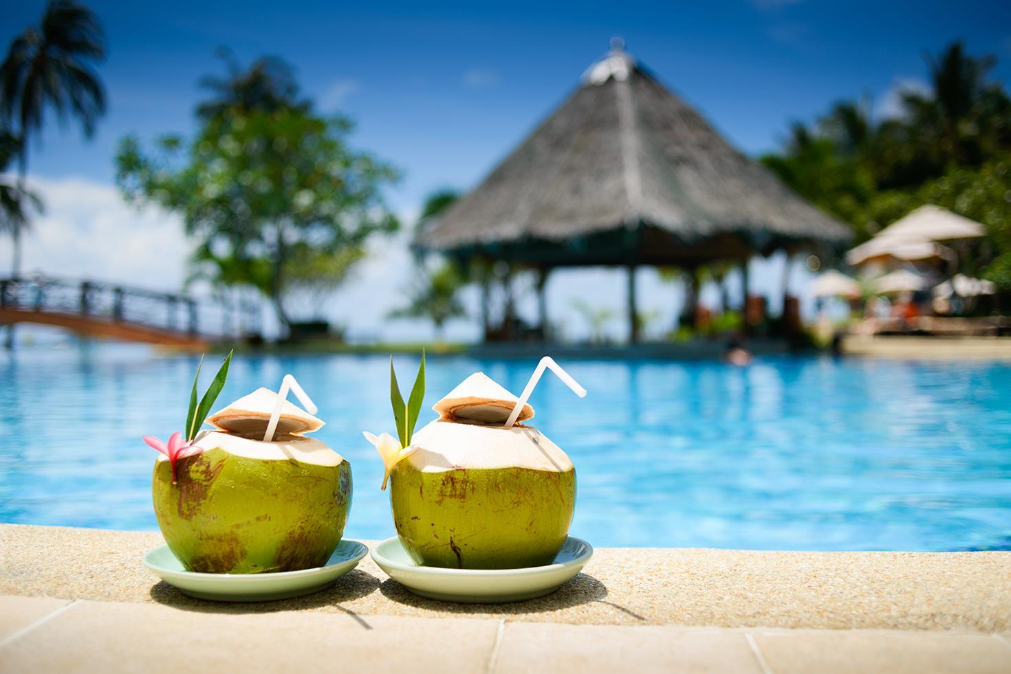 Coconut drinks on the edge of a pool